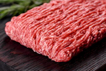 Fresh raw beef mince on a dark background