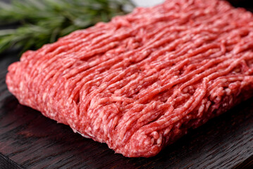 Fresh raw beef mince on a dark background