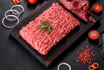 Fresh raw beef mince on a dark background