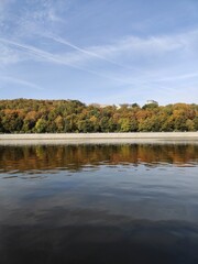 Luzhnetskaya embankment in Moscow. View of autumn trees and Stalin's skyscraper