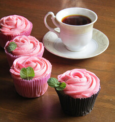 Rose shaped cupcakes with cup of coffee