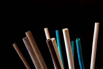 black background with set of colored aroma sticks, isolated close-up