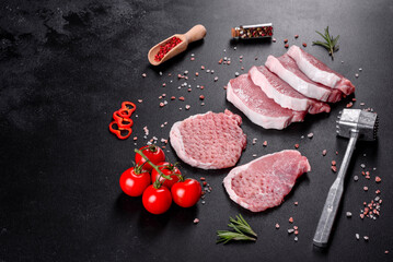 A fresh raw piece of pork escalop cut into several parts