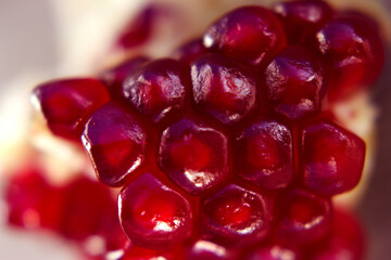 unfocused pomegranare red seeds bunch background - close up, healthy food