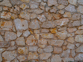 The surface of the stone wall.