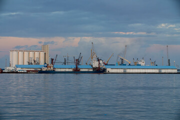 Tripoli, Libya - November 25, 2020: Container ships with loading cranes in the Port of Tripoli - obrazy, fototapety, plakaty