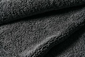 Gray cleaning rag microfiber cloth or towel for cleaning and household. Abstract dark fabric...