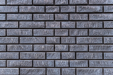 Gray and black brick wall background

