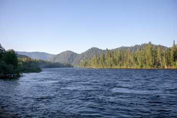  Ob river flows through the taiga. River landscape, beautiful sky