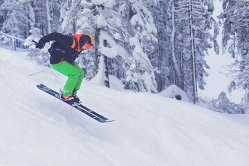 Ski jumping in a winter forest in Mayrhofen, Austria