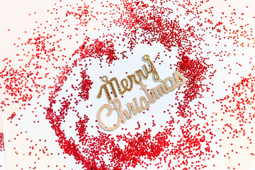 Words Merry Christmas on a colored background. Merry Christmas. Merry Christmas on a colored background with decorations.