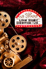 Movie night date plan. Romantic anniversary gift. Gingerbread figure cookie with icing, hand...