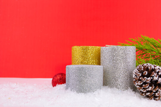 new year greeting card, bright candles and cone on snowy background