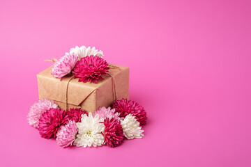 Eco zero waste style gift wrapping. Composition with craft paper giftbox decorated with flowers
