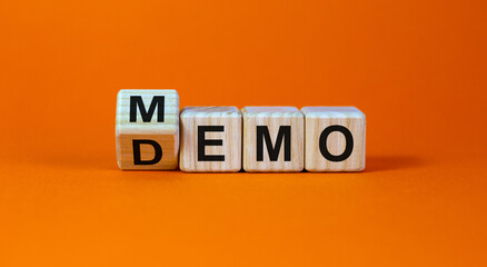 Turned cube and changed the word 'demo' to 'memo'. Beautiful orange background. Business and demo...