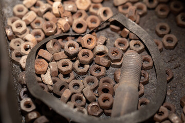 pile of old rusty bolts and nuts