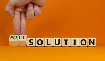 Time to full solution. Hand turns cubes and changes words 'solution' to 'full solution'. Beautiful orange background. Business and full solution concept. Copy space. © Dzmitry