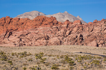 Fototapeta premium Towering red sandstone peaks at Red Rock Canyon National Conservation Area in Las Vegas, Nevada 