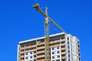 Fototapeta premium Crane and highrise construction site