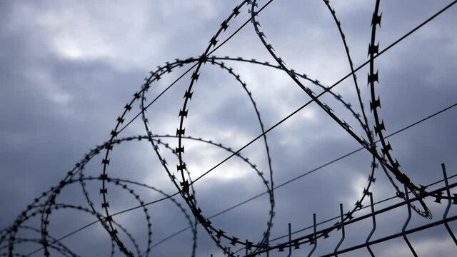 Fence from a lattice and a barbed wire	