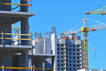 Crane and highrise construction site