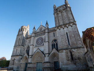 View on the Poitiers Cathedral (in french, cathédrale Saint-Pierre de Poitiers), a Roman Catholic church. Poitiers is a city located in France. Blue sky and sunny day.