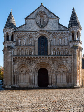 Facade of Notre-Dame la Grande, a Roman Catholic church in Poitiers, France. Blue sky, photographed in a sunny day.