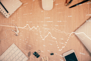 Multi exposure of forex graph hologram over desktop with phone. Top view. Mobile trade platform concept.