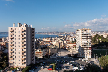 View on building of the city of Marseille. Mediterranean sea in the background. Marseille is a city in the south of France. © Adrien