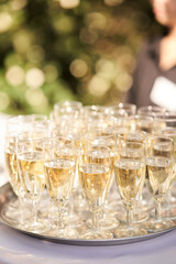 Glasses of champagne on a silver tray at a family celebration