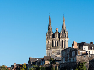 Fototapeta na wymiar View on the Angers cathedral. Sunny day, blue sky. Angers is a city located in the Maine-et-Loire department in France.
