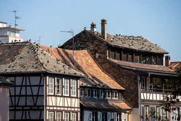 Fototapeta na wymiar View on the old houses in the old town of Strasbourg. The city is the capital and largest city of the Grand Est region of France. Houses with half-timbering.