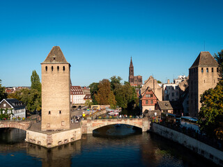 View on the famouse "La Petite France" (also known as the Quartier des Tanneurs) a historic quarter of the city of Strasbourg in eastern France. We can see the city cathedral in the background.