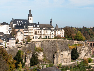 Fototapeta na wymiar Old town in Luxembourg city. View of the cliffs and churches of the Luxembourg capital. Photographed in the fall.