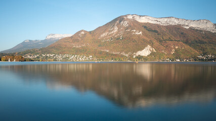 View on the famous lake of Annecy, a city located in Savoie, France. Reflection on the water. Sunny day, autumn. 