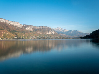 Landscape in Annecy, Savoie, France. In the autumn, view on the lake, daylight, blue sky and reflection.