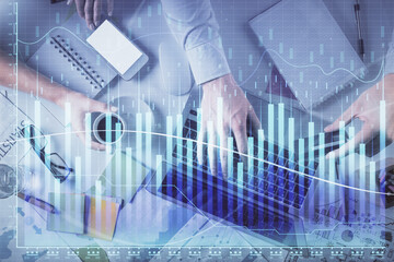 Double exposure of man and woman working together and forex graph hologram drawing. Financial analysis concept. Computer background. Top View.