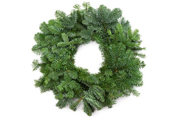 Green Christmas wreath made of natural fir branches, not decorated, top view, selective focus, white background © Liliya Trott