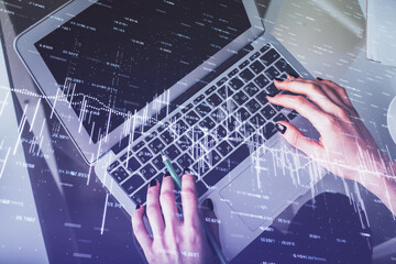 Double exposure of woman hands working on computer and forex chart hologram drawing. Top View. Financial analysis concept.