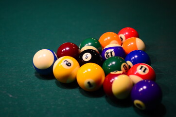 billiard balls on a green table