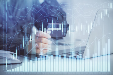 Multi exposure of woman on-line shopping holding a credit card and financial graph drawing. Stock market E-commerce concept.