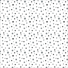 grey polkadot background with black and dark grey dots