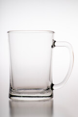 Pouring water into a mug. Glass container for weak carbonated alcohol.