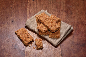 Crunchy granola bars on a wooden background   