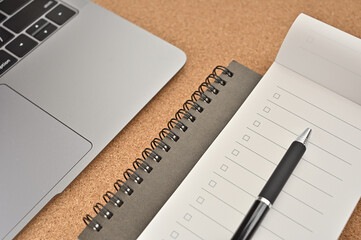 There's a blank checklist there. On the table, along with laptop and notebook.