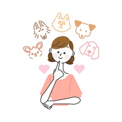 どの種類の犬を飼おうかと楽しく悩んでいる女性