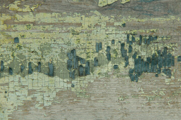 Old board with remains of multilayer paintings