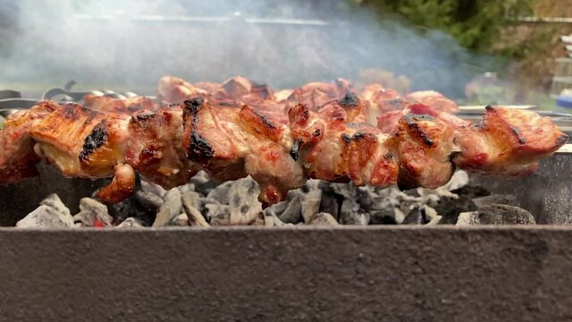 Pork Shashlik Is Fried On The Smoke On The Grill In Slow Motion