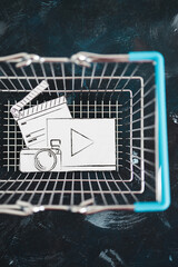 creative content sold online, photo and video digital downloads icon in shopping basket