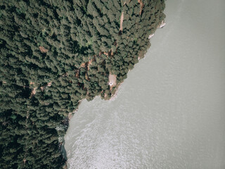 Beautiful natural scenery of river in southeast Asia tropical green forest with mountains in background, aerial view drone shot